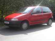 Red 3 door Fiat punto 